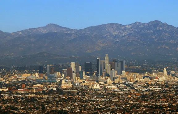Downtown Los Angeles with San Gabriel Mountains in the background.