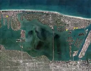 Miami Beach isn’t sinking; the water around it is rising. If sea levels rise 2 feet over the next 25 years, 40% to 60% of the Florida city is projected to flood regularly. Yellow dots show locations most at risk.