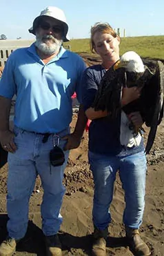 Pictured are John Jones of SCS Engineers, Lisa Martin of AWRC, and JJ the rescued eagle. John visited JJ at AWRC on Wednesday, where he is currently recovering.