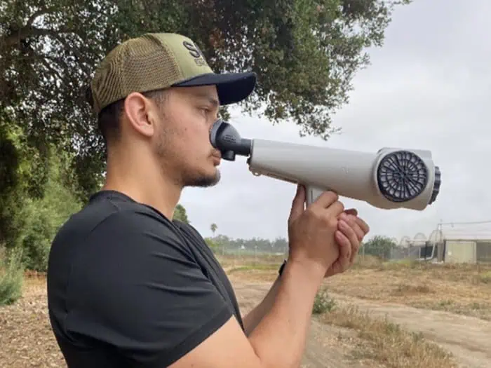 A portable, handheld device used to measure and quantify ambient odors in the outside air.